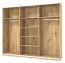 Dreitüriger Schwebetürenschrank Crina 10, Farbe: Eiche Artisan / Schwarz, Spiegel, zwei Kleiderstangen, ABS-Kanten, Maße: 224 x 262,5 x 65,5 cm