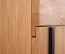 Schrank Slatina 49, Farbe: Eiche / Schwarz, teilmassiv - Abmessungen: 203 x 56 x 63 cm (H x B x T)