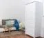 Schmaler Kleiderschrank | 1 Drehtür | 4 Schubladen | mit Kleiderstange | 80 cm breit | Massivholz Kiefer | Farbe: Weiß Abbildung